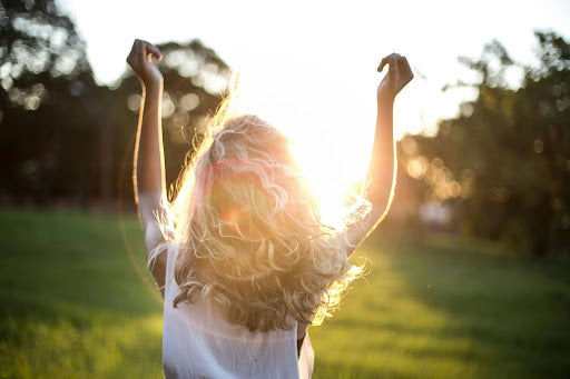 Woman with long hair on a sunny day. Credit: Garon Piceli, Pexels