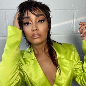 Image of Leigh Anne Pinnock with a modern mullet in a neon green jacket. Taken from Instagram