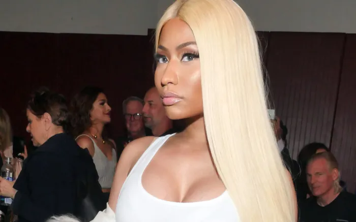 Nicky Minaj with sleek, long platinum hair.