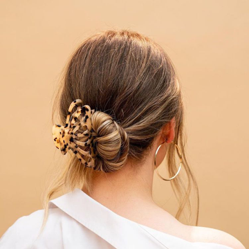 Image of a girl with her hair tied in a claw clip.